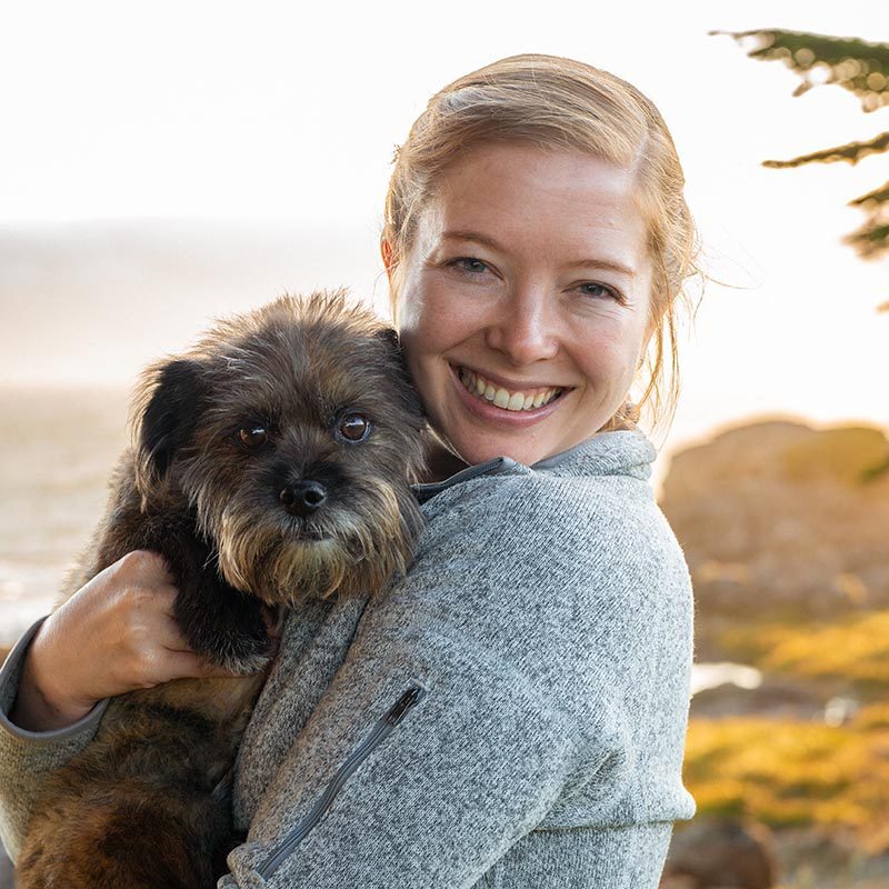 Dr. Boyles holding her shaggy dog